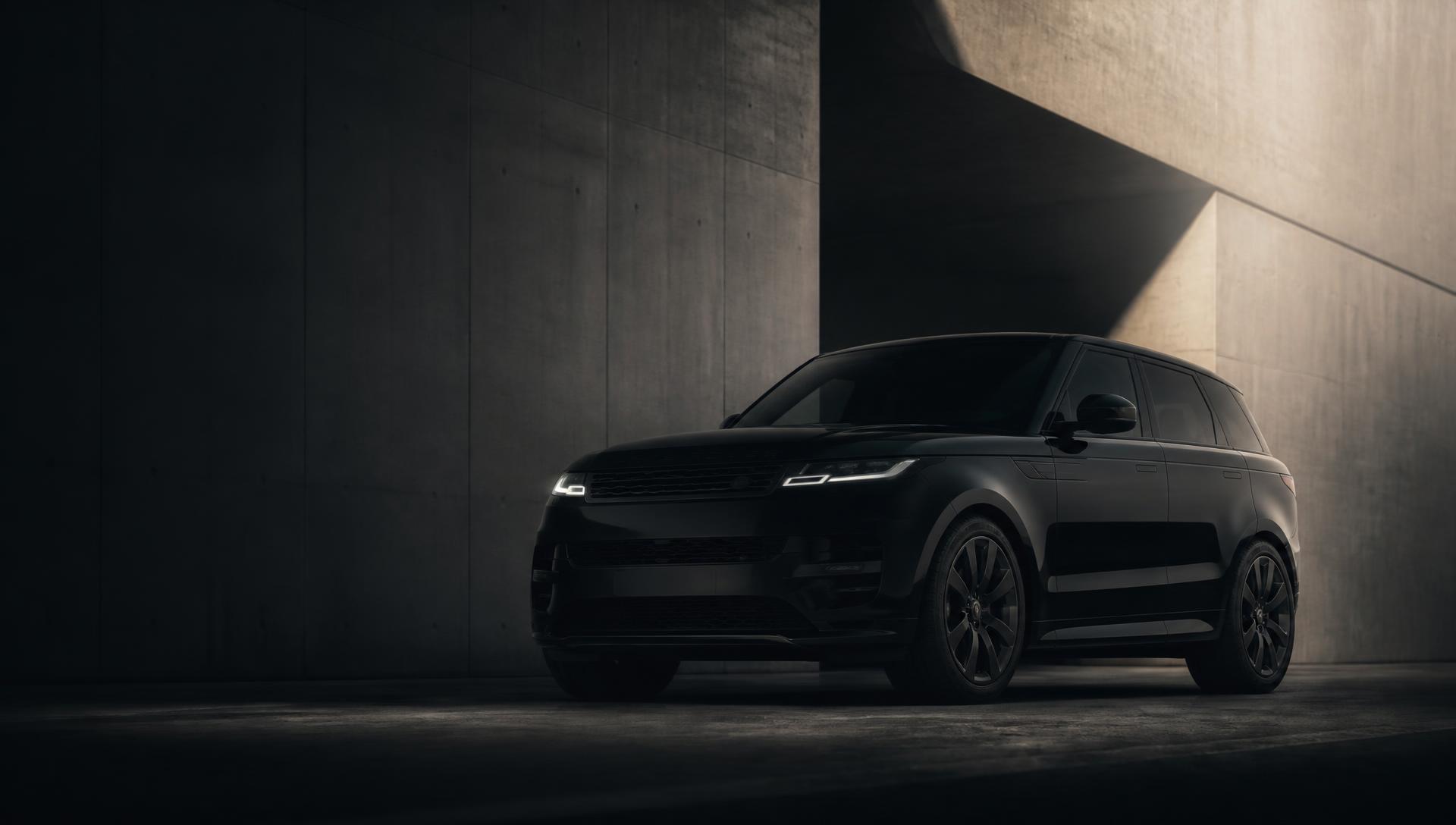 Black Range Rover in a dark architectural space